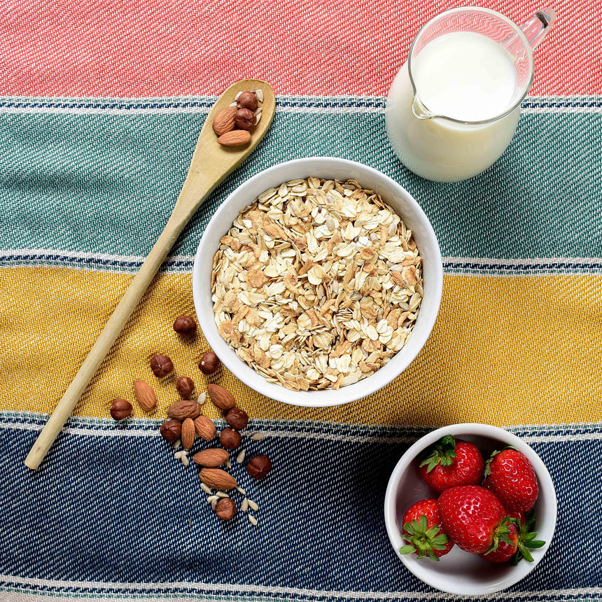 bowl of oats with nuts and strawberries 
